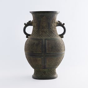 A Chinese bronze vase with double dragon handles, Ming dynasty