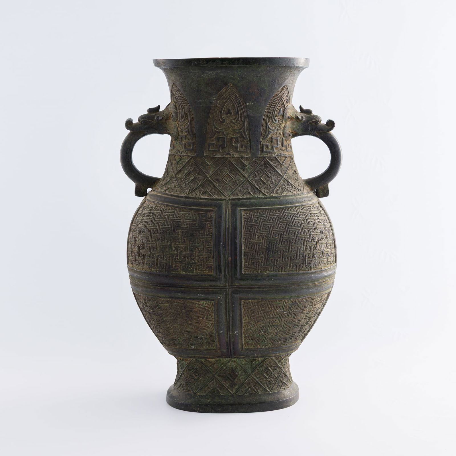 A Chinese bronze vase with double dragon handles, Ming dynasty (1 of 10)