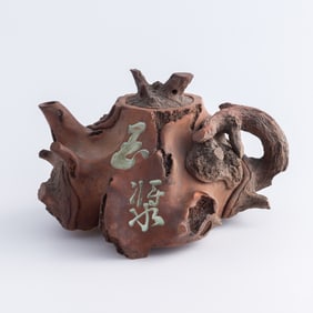 A Chinese Qinzhou-kiln tree trunk-shaped teapot, early 20th century