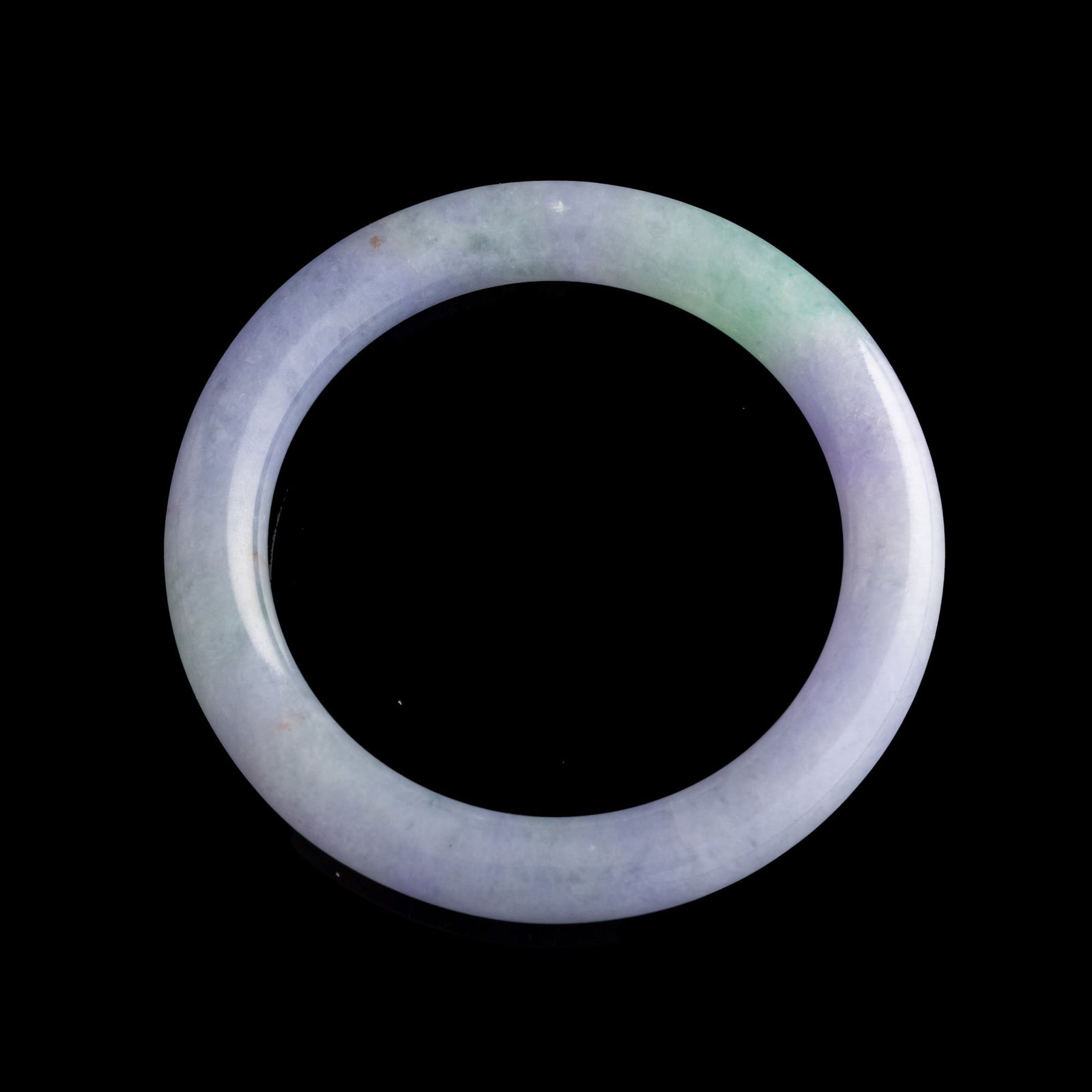 A Chinese carved jadeite bangle, 19th century