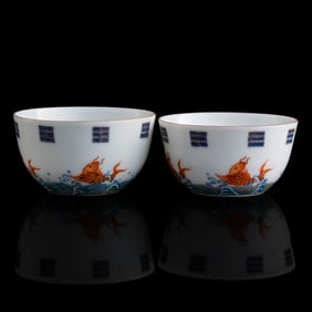 A pair of Chinese doucai 'fish' and 'bagua' cups