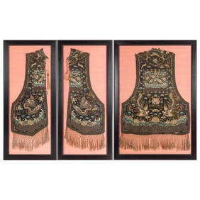 A set of three framed panels from a black-ground court garment, 19th century