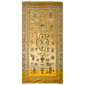 A Chinese yellow-ground brocade rug, 19th century
