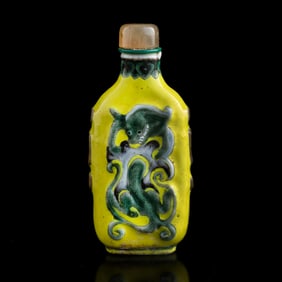 A Chinese yellow-ground carved porcelain snuff bottle, 19th century