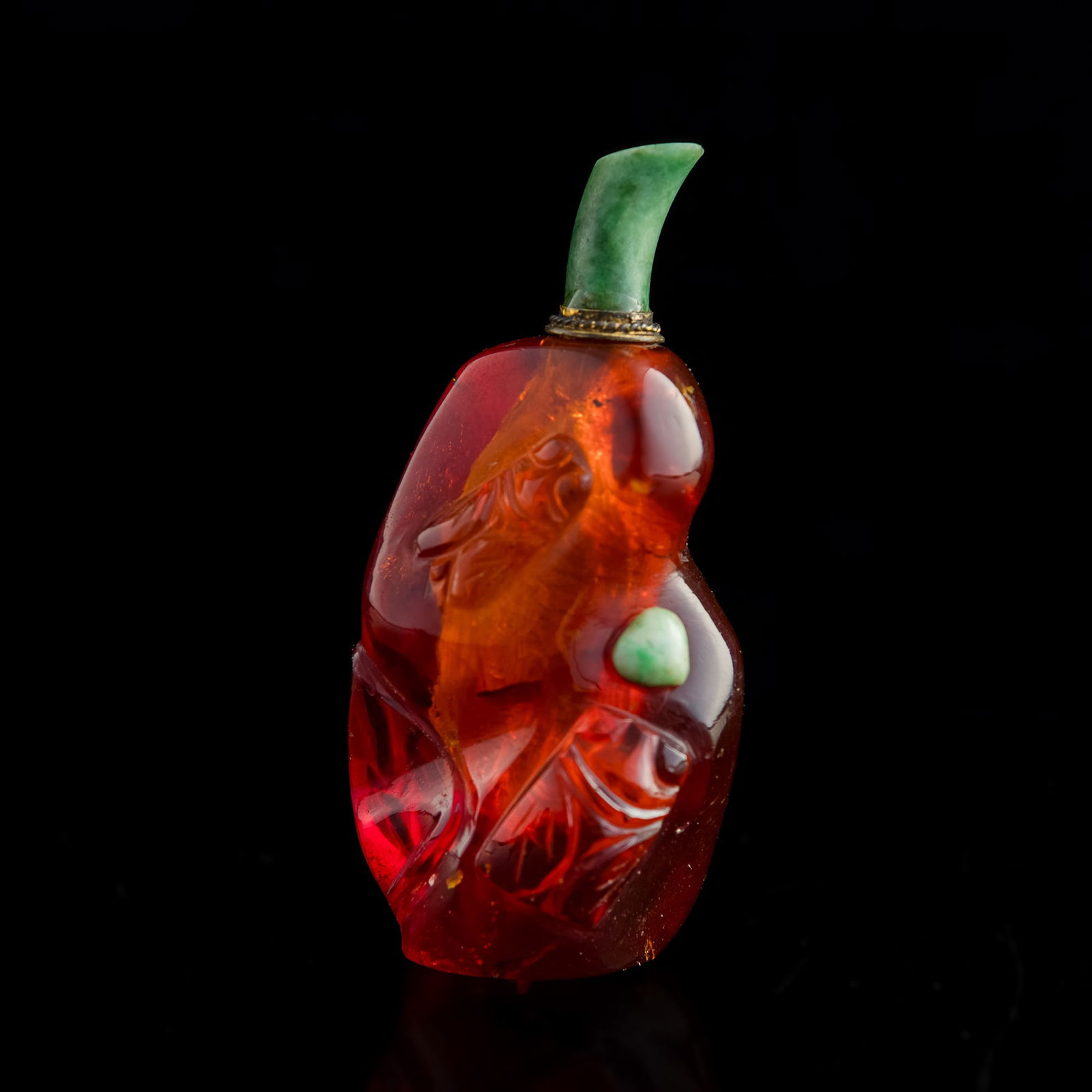 A Chinese jadeite-decorated amber snuff bottle, 19th century (1 of 7)