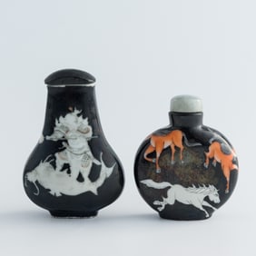 Two Chinese black-ground snuff bottles, 19th century