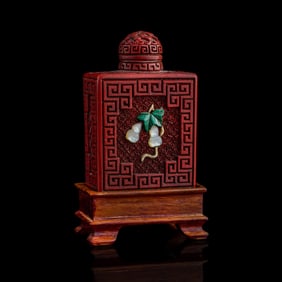 A Chinese precious stone-inlaid cinnabar snuff bottle, late 19th century