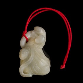 A Chinese white jade 'monkey' toggle, 19th century