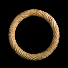 A Chinese jade bangle with twisted design, Ming dynasty