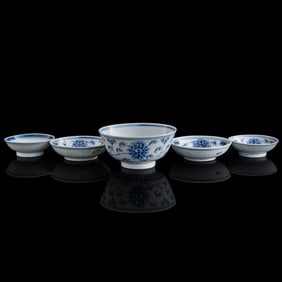 Four Chinese blue and white dishes and a bowl, late 19th century
