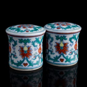 A pair of Chinese doucai 'lotus' scroll ends, 19th century