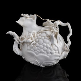 A Chinese white-glazed pomegranate-form teapot, 19th century