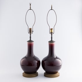 A pair of Chinese red-glazed tianqiu vase lamps, 19th century