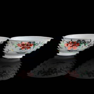 A pair of Chinese famille rose 'floral' bowls, 17th/18th century: A pair of Chinese famille rose 'floral' bowls 17th/18th century Each depicting blooming peonies and butterflies to the exterior. (2). H: 3, Dia: 6 3/4 in. (H: 7.62, Dia: 17.15 cm. (largest)) From a co