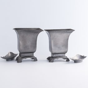 A pair of Chinese pewter flower holders and a pair of leaf-shaped dishes, Republic period