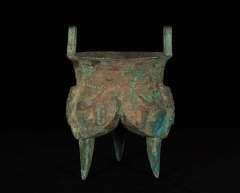 A Chinese bronze tripod 'taotie' li ding, late Shang/early Western Zhou dynasty