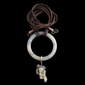 A Chinese black and white jade bangle and pendant, 19th century
