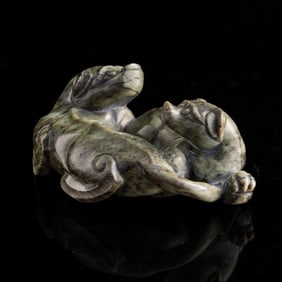 A Chinese jade carving of double beasts, Ming dynasty