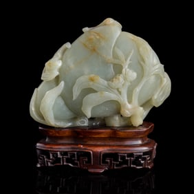 A Chinese carved jade double-peach ornament, 18th century