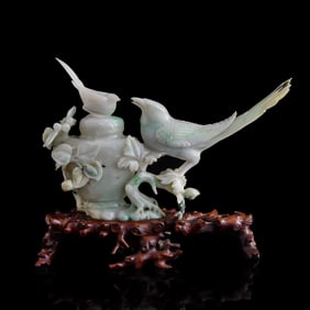 A Chinese carved jadeite lidded vase