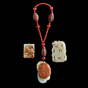 Two Chinese carved jade plaques and a pendant