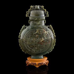 A Chinese celadon jade lidded vase
