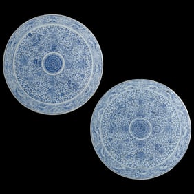 A pair of Chinese blue and white 'Eight Buddhist Emblems' roundels, early 19th century