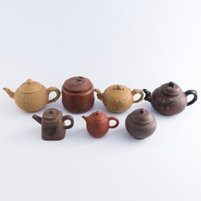 Five Chinese Yixing zisha teapots and two tea caddies