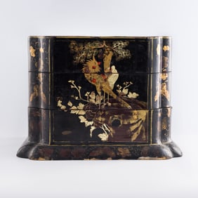 A Chinese black lacquer painted tiered box, Qing dynasty