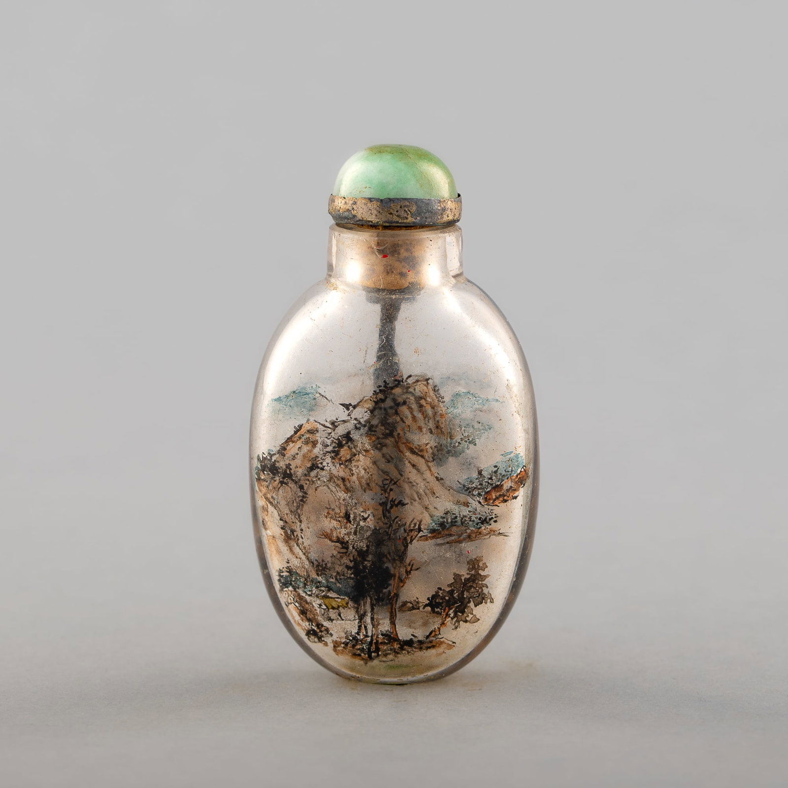 A Chinese inside-painted snuff bottle, 19th century: A Chinese inside-painted snuff bottle 19th century With landscape scenes painted to each side. H: 2 1/8, W: 1 3/8 in. (H: 5.40, W: 3.49 cm.) Mrs. Hillebrand, Chicago, Illinois. Her father-in-law purch