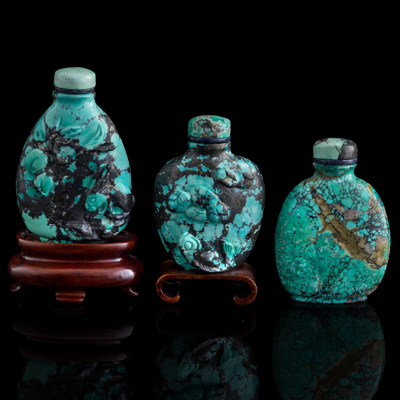 Three Chinese turquoise snuff bottles, early 20th century: Three Chinese turquoise snuff bottles early 20th century Sold with two associated stands. (3). H: 2 1/2, W: 1 5/8, D: 7/8 in. (H: 6.35, W: 4.13, D: 2.22 cm. (largest, overall)) Weight: 192.32 g (total
