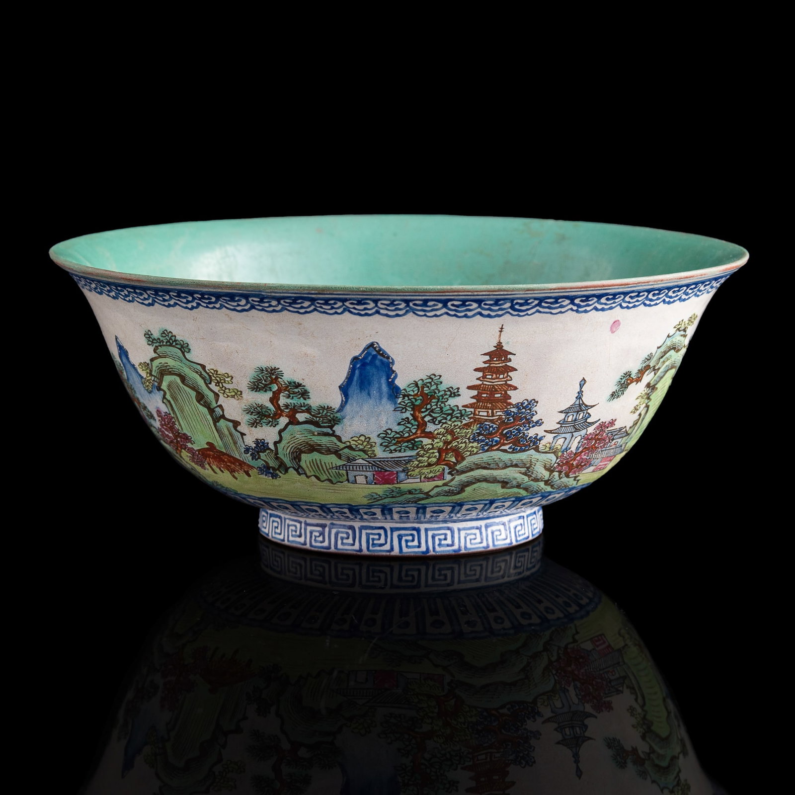 A Chinese enameled zisha bowl, Qing dynasty: A Chinese enameled zisha bowl Qing dynasty Enameled with landscape scenes and floral motifs. H: 3 1/8, Dia: 7 3/4 in. (H: 7.94, Dia: 19.69 cm.) Private collection, Pennsylvania.