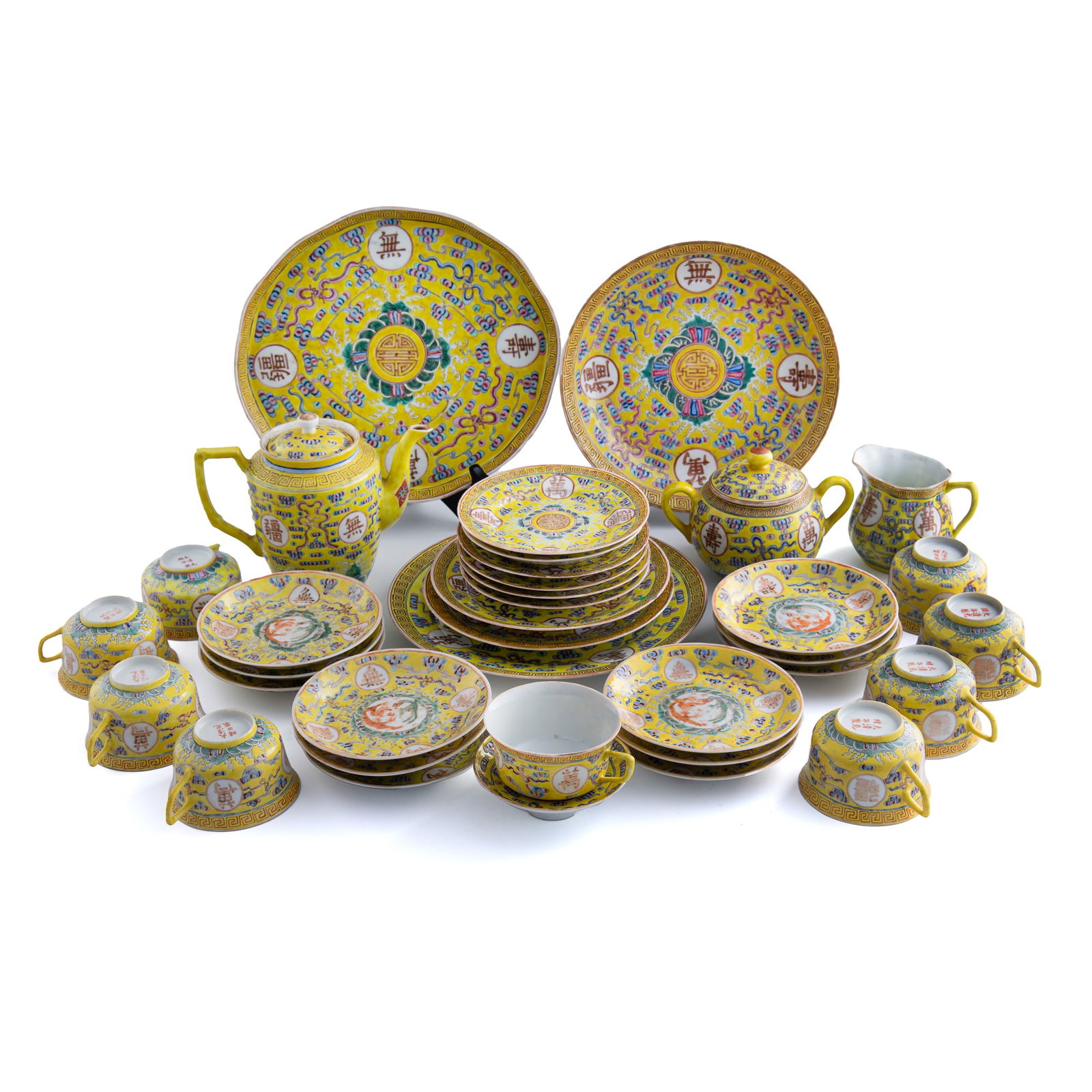 Thirty-six pieces of Chinese famille rose dinner set, Guangxu period, Qing dynasty: Thirty-six pieces of Chinese famille rose dinner set Guangxu period, Qing dynasty Comprising thirty-six yellow-ground famille rose saucer, tea cups, sugar, cream, teapot and plates of various sizes. M