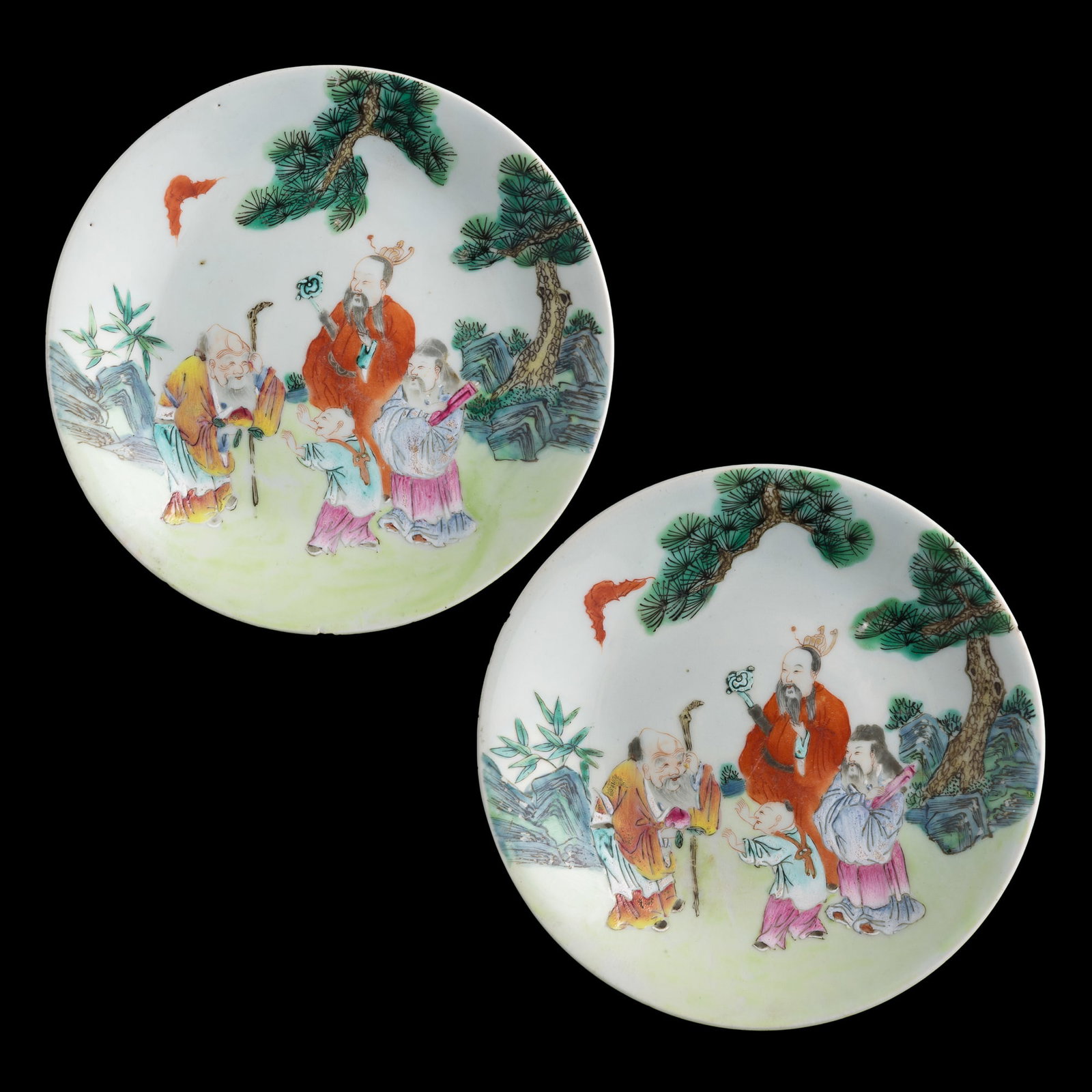 A pair of Chinese famille rose 'Sanxing' plates, Jiaqing period, Qing dynasty: A pair of Chinese famille rose 'Sanxing' plates Jiaqing period, Qing dynasty Each depicting gods of longevity under pine trees to the center and six-character Jiaqing mark to underside. (2). H: 1, Dia
