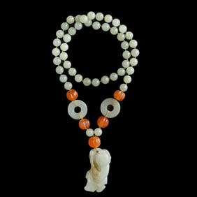 A Chinese white jade boy pendant necklace, 19th century