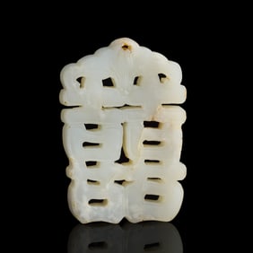 A Chinese white jade 'double happiness' plaque, early 19th century