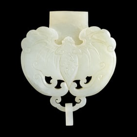 A Chinese white jade 'bat' ornament with suspension loop, 18th century