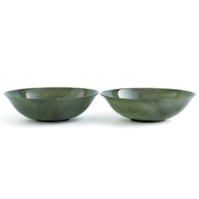 A pair of Chinese spinach jade bowls, 19th century