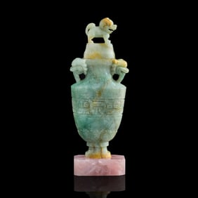 A Chinese jadeite lidded vase with lion finial, 19th century