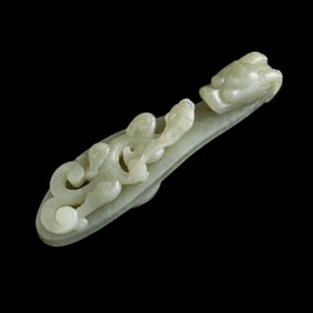 A Chinese celadon jade dragon hook, Ming dynasty