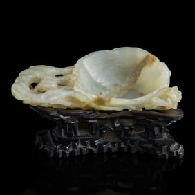 A Chinese jade 'plum blossom'-form washer, 19th century