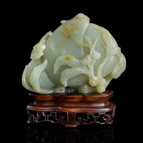A Chinese carved jade double-peach ornament, 18th century