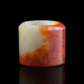 A Chinese red jadeite archer’s ring, 19th century