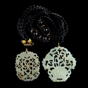 Two Chinese reticulated white jade plaques, early 19th century