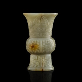 A Chinese carved jade gu vase, 18th century