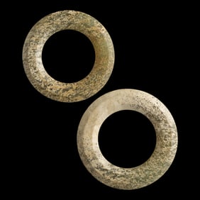 A pair of Chinese jade rings, Warring States period