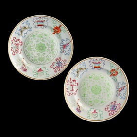 A pair of Chinese famille rose 'lotus' and 'Eight Treasures' plates, Xuantong period, Qing dynasty