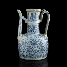 A Chinese blue and white 'scrolling lotus' ewer, Ming dynasty