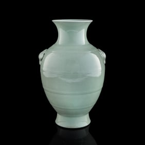 A Chinese celadon elephant-handled zun vase, Qing dynasty