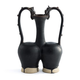 A Chinese black-glazed double-dragon-handled twin ewer, Tang dynasty